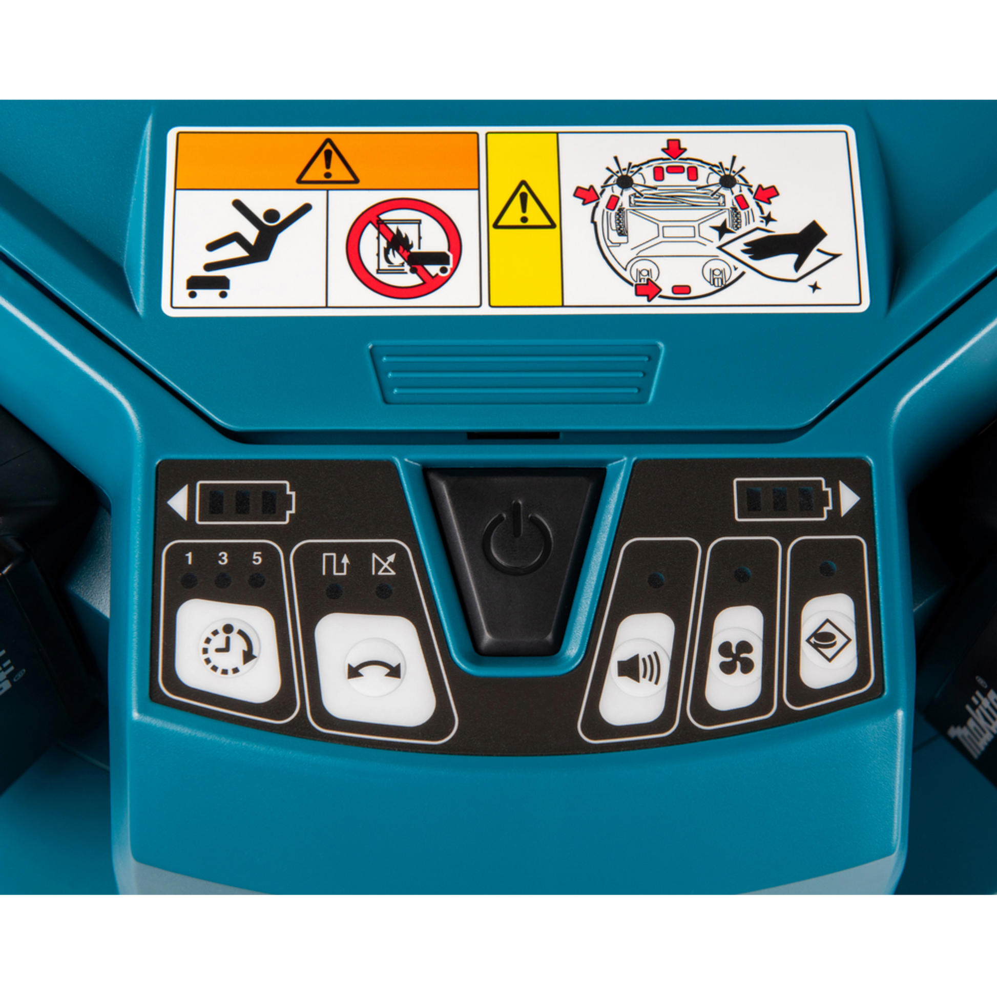 Control panel with warning labels on a blue machine