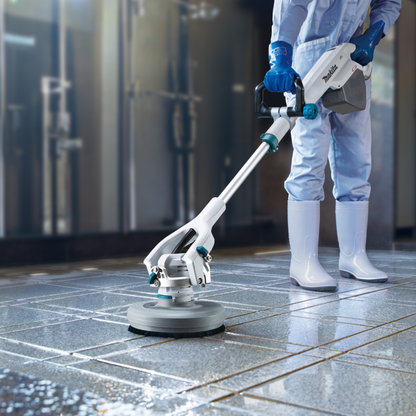 Person using a floor polisher on a tiled floor
