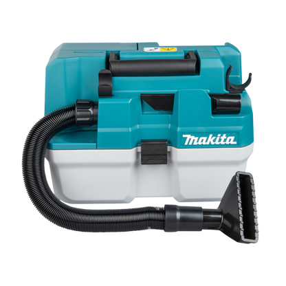 Makita vacuum cleaner with hose and attachment on a white background